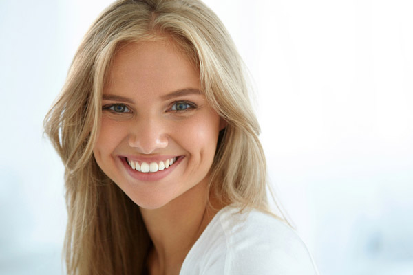 Young woman smiling.